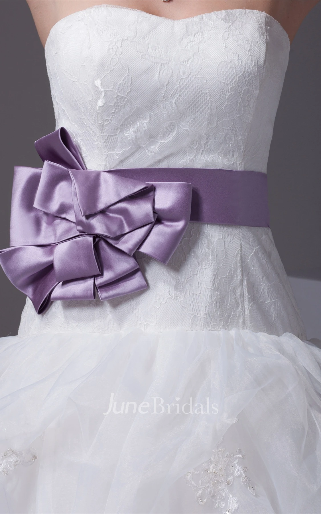 Strapless Ruffled Ball Gown with Bow and Appliques