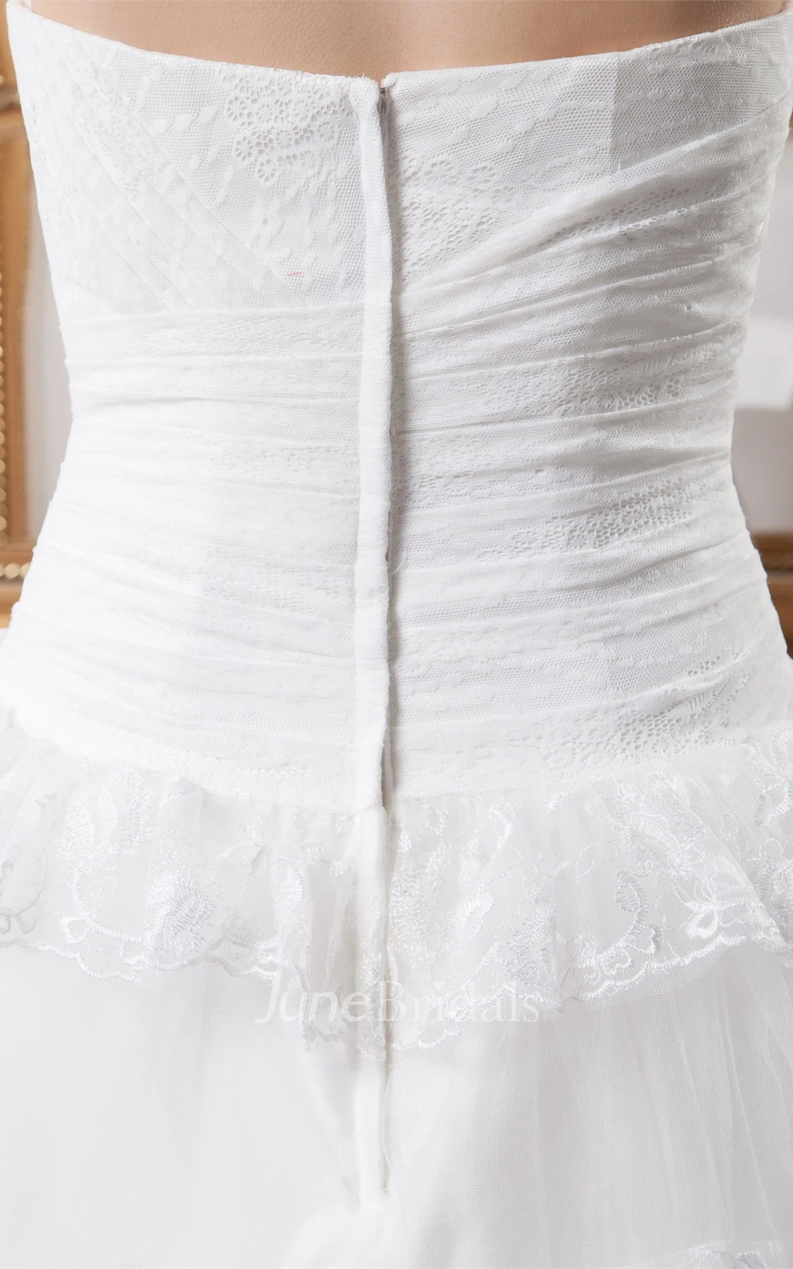 Strapless Tulle Ball Gown with Peplum and Appliques