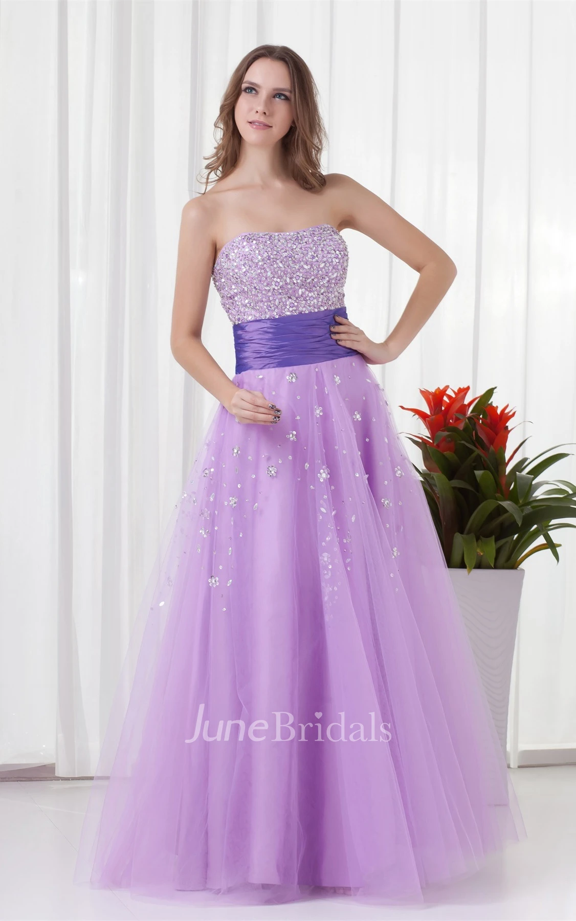 strapless a-line tulle dress with ruched waist and jeweled top