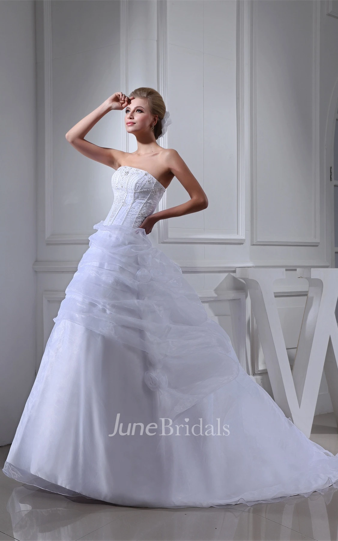 Strapless Ruffled Tulle Ball Gown with Flower and Gemmed Bodice