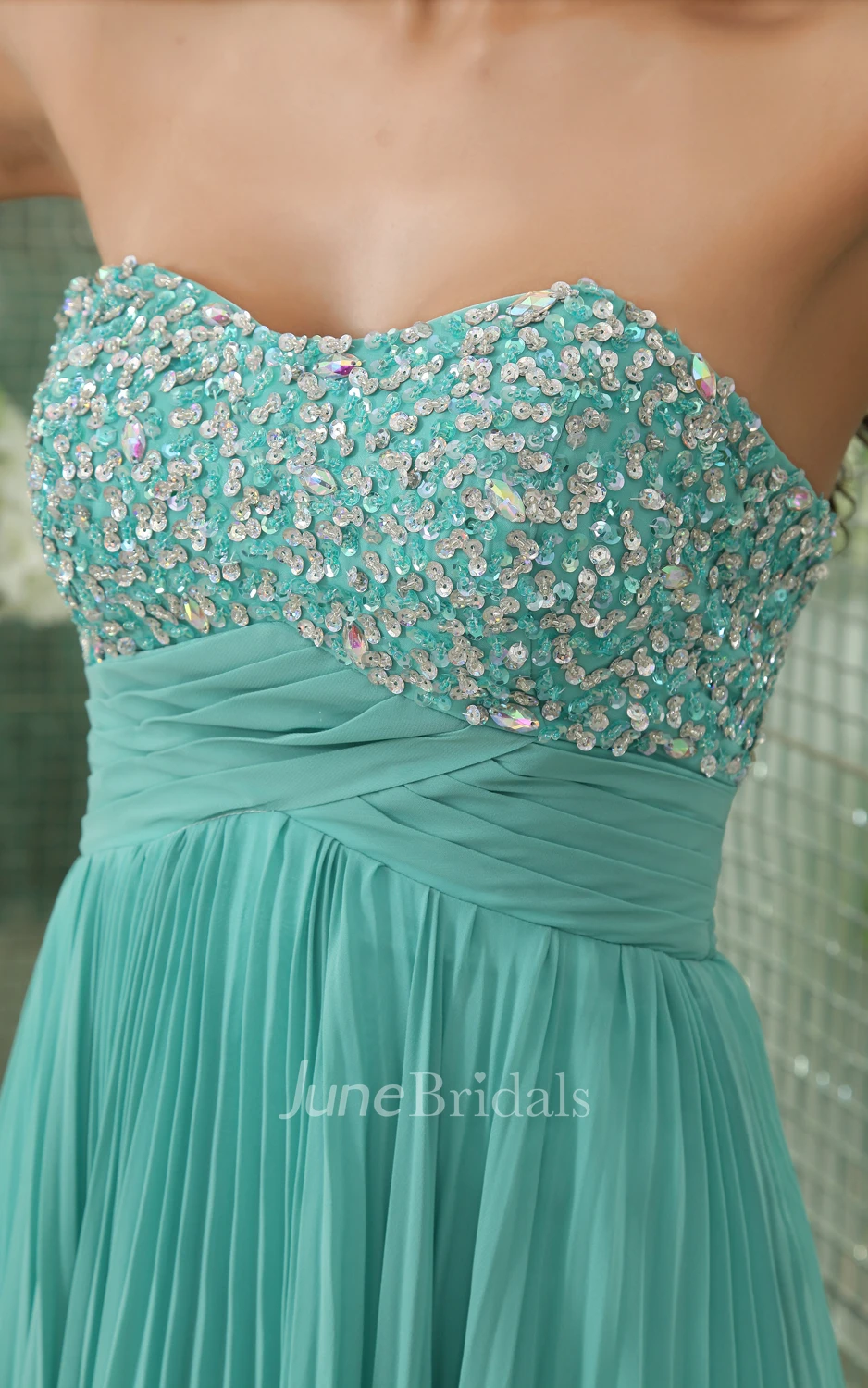 Pleated Empire Soft Flowing Fabric Gown With Sequined Bodice