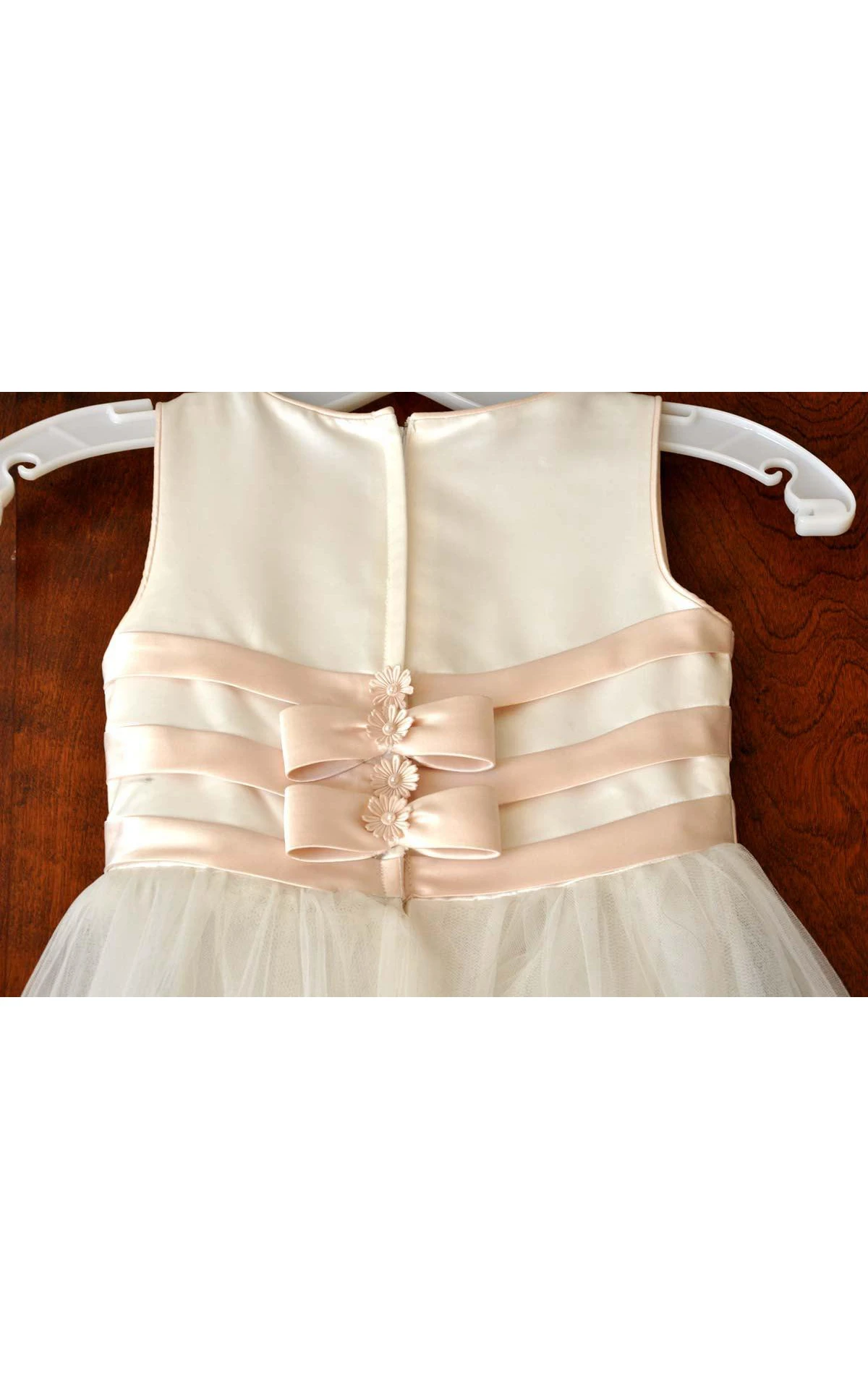 Mon Cheri Ivory Sleeveless Bateau Neck Flower Girl Tulle Dress With Flower Detailing