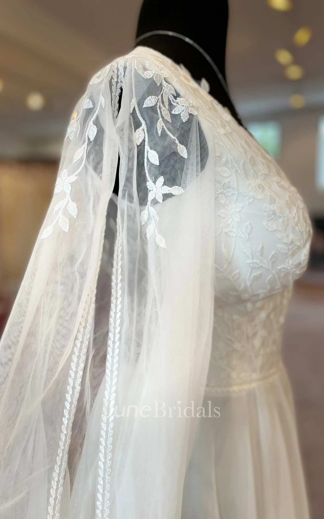 Romantic A-Line Tulle Spring Wedding Dress With Illusion Long Sleeves And Keyhole Back