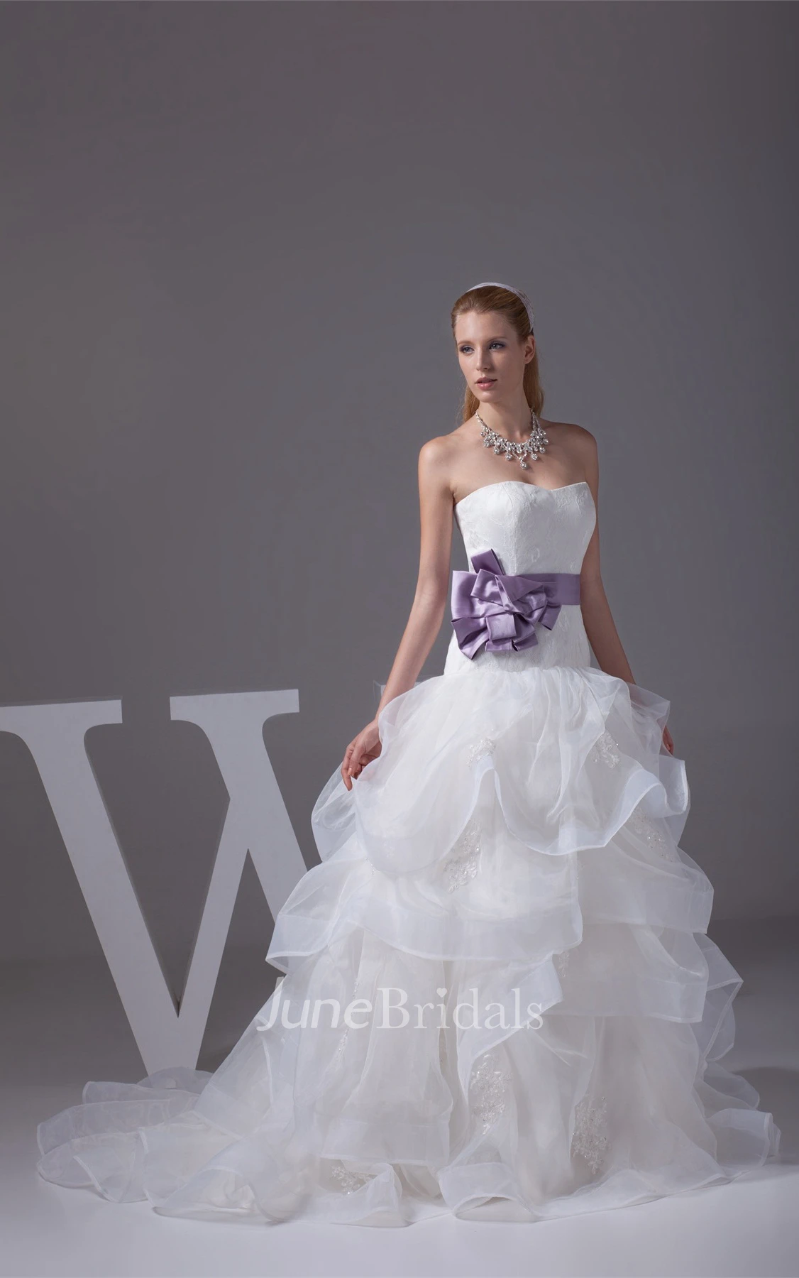 Strapless Ruffled Ball Gown with Bow and Appliques