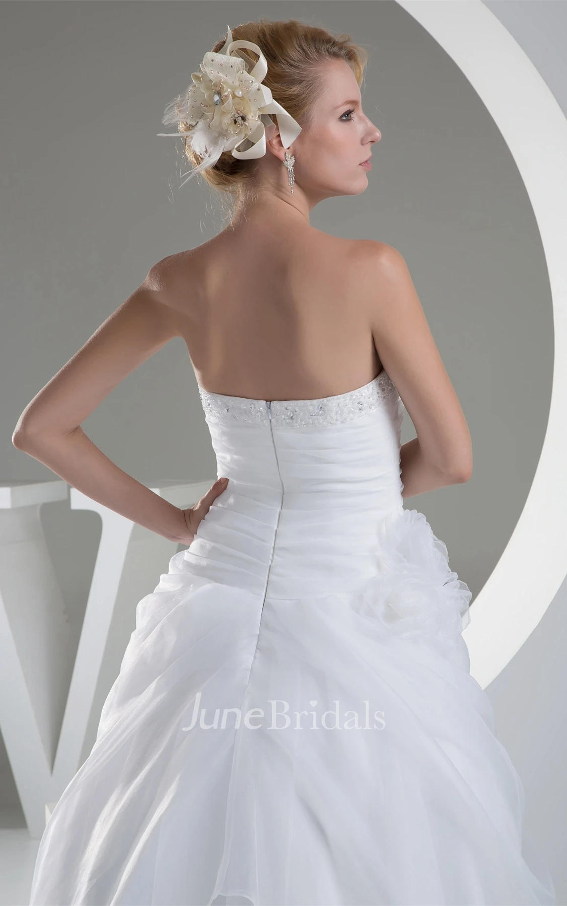 Strapless Ruched Jeweled Ball Gown with Flower and Ruffles