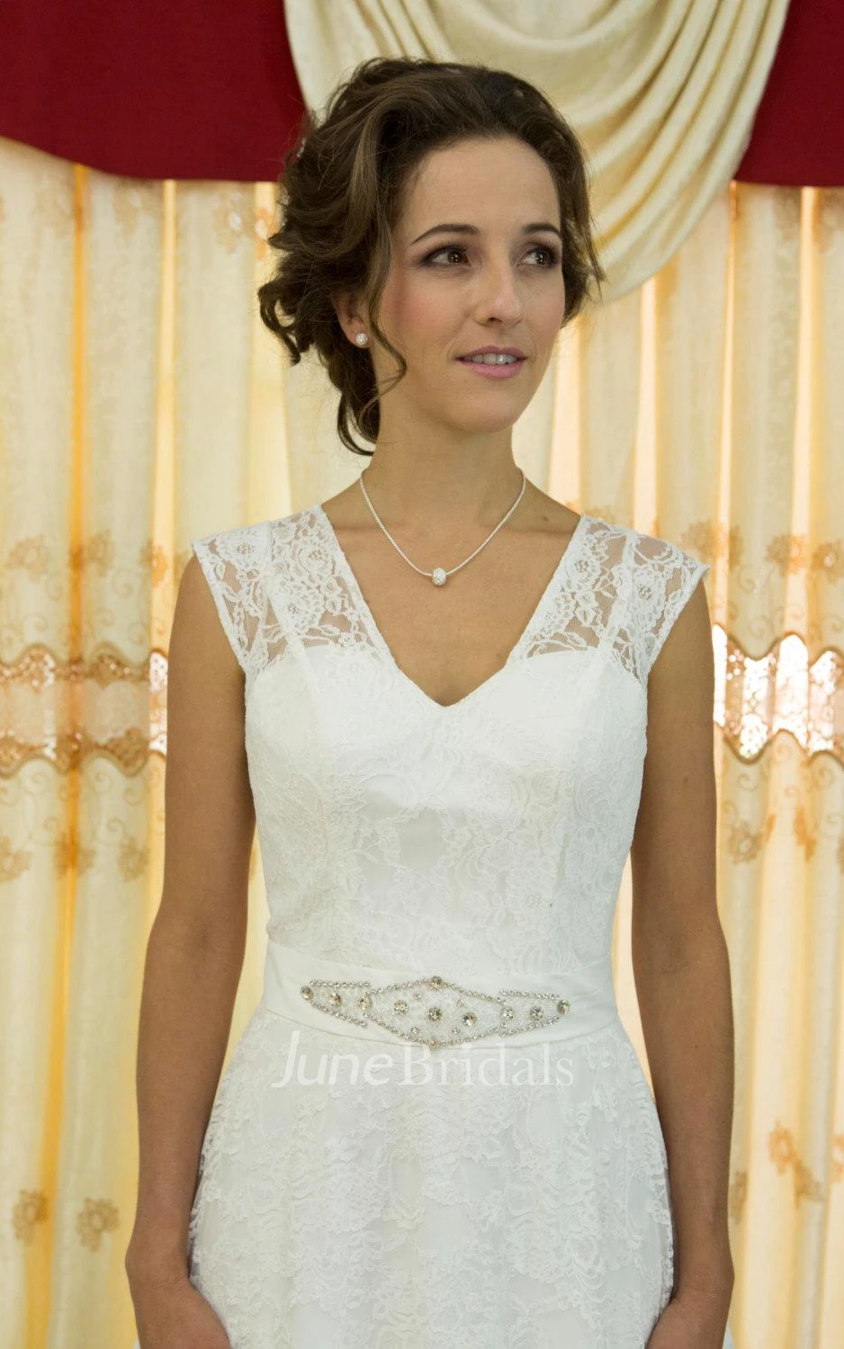Lace Overlaying A-Line Wedding Gown With See Through Back