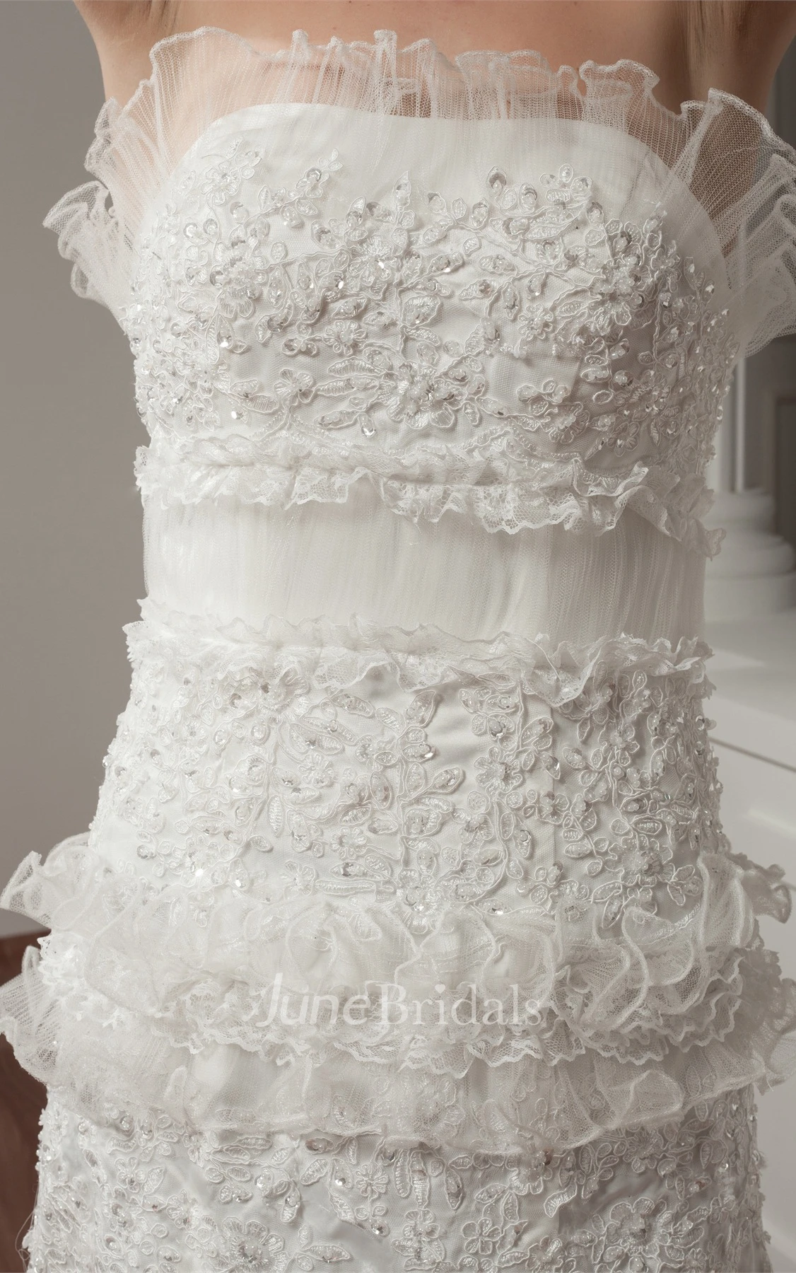 Strapless A-Line Ruffled Gown with Appliques and Peplum