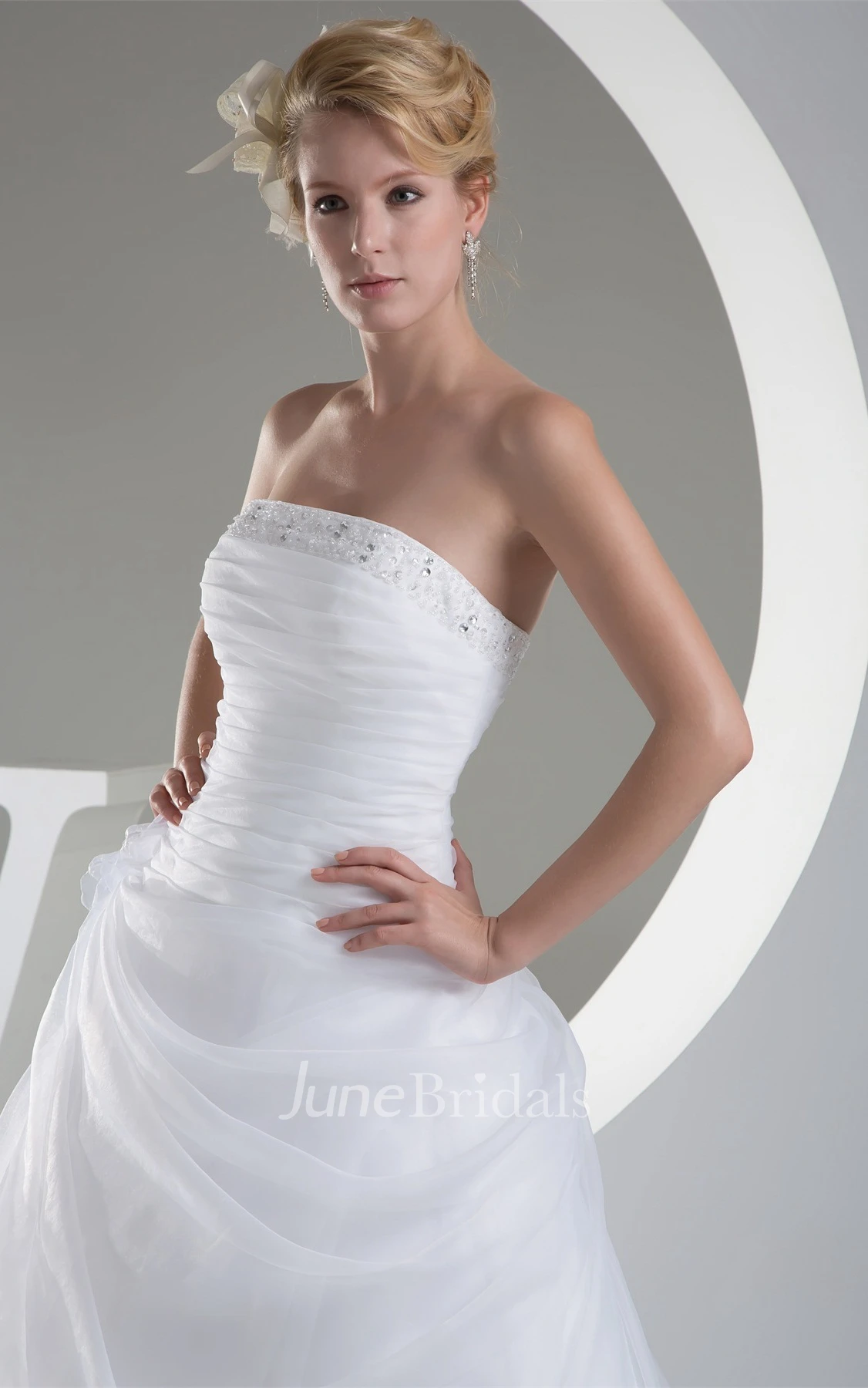 Strapless Ruched Jeweled Ball Gown with Flower and Ruffles