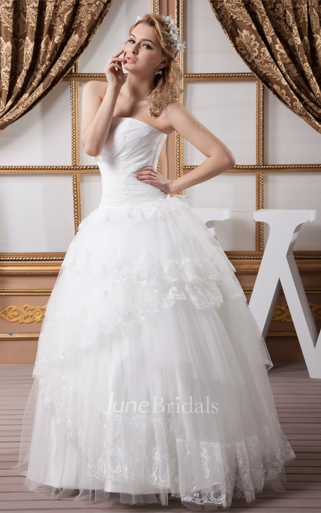 Strapless Tulle Ball Gown with Peplum and Appliques