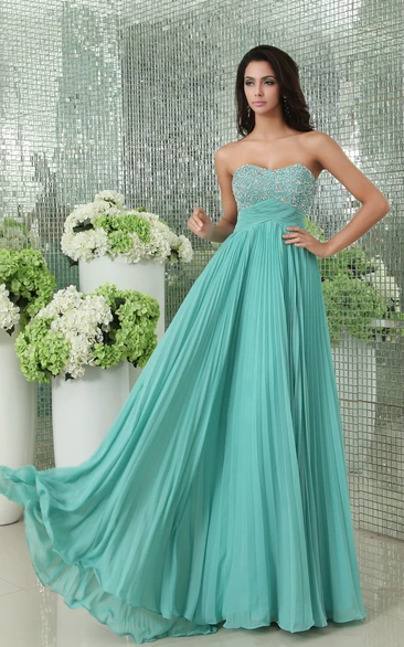 Pleated Empire Soft Flowing Fabric Gown With Sequined Bodice