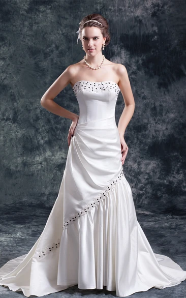 strapless draped a-line satin gown with appliques and beading