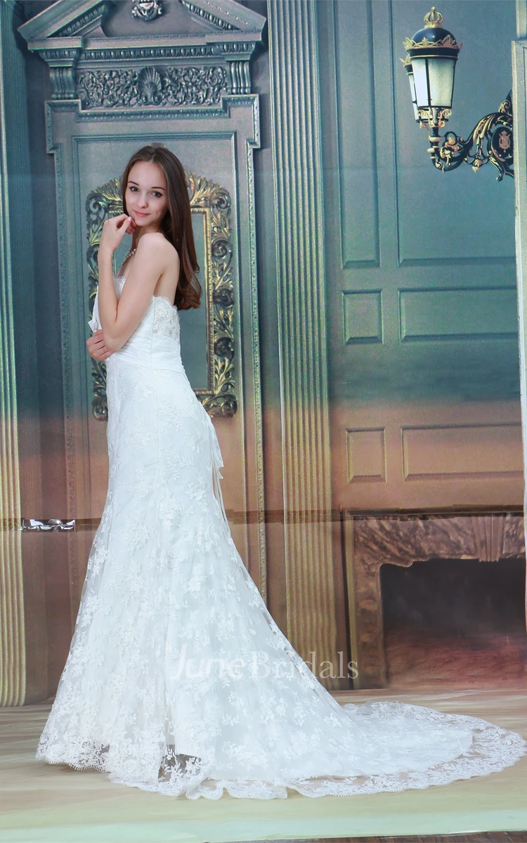 strapless a-line mermaid gown with bow and central ruching