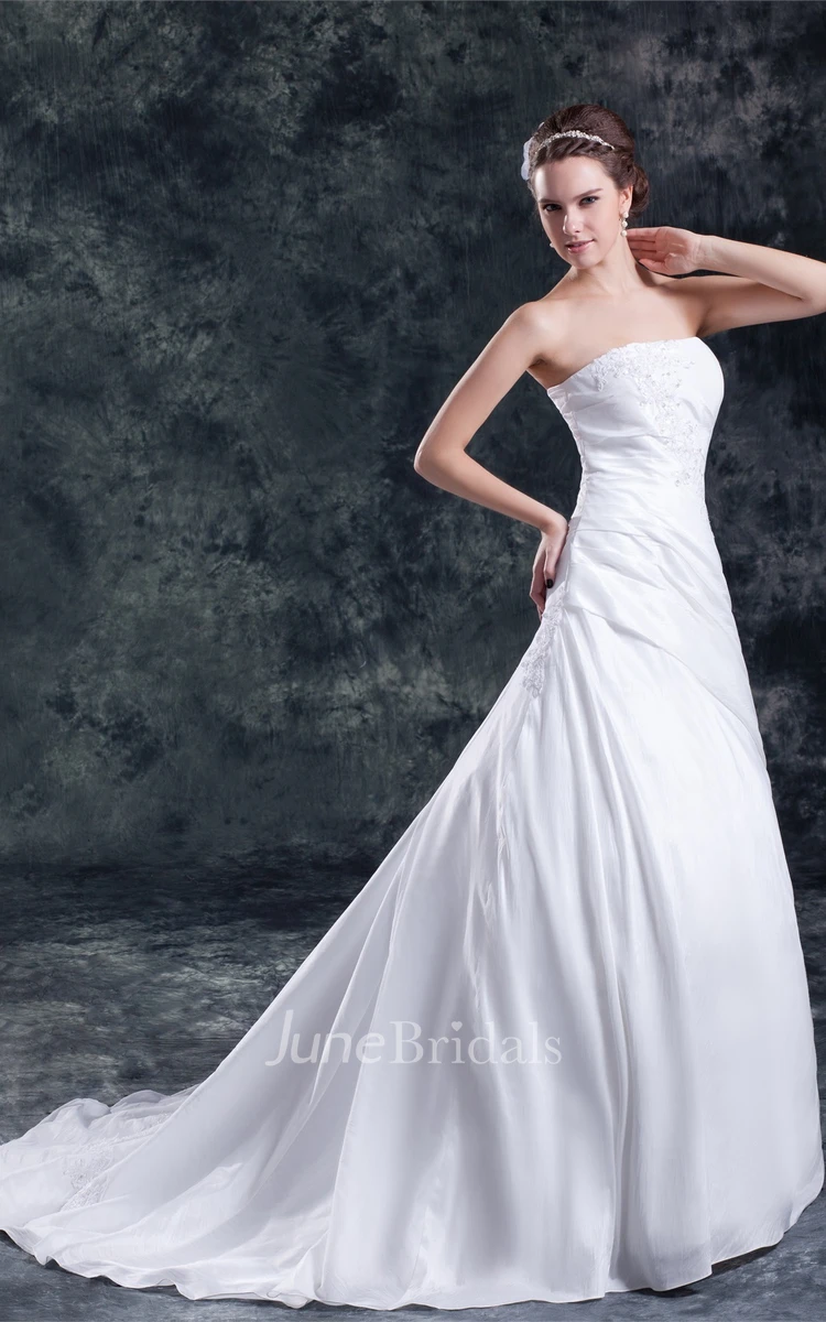 strapless a-line gown with corset back and appliques
