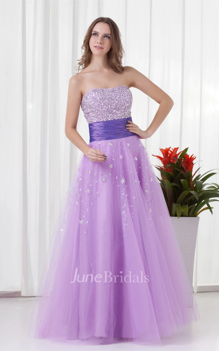 strapless a-line tulle dress with ruched waist and jeweled top