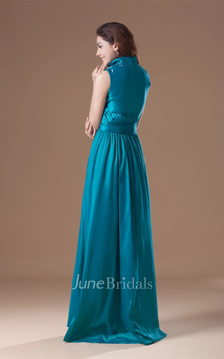 high-neck floor-length sleeveless dress with pleats and embroideries