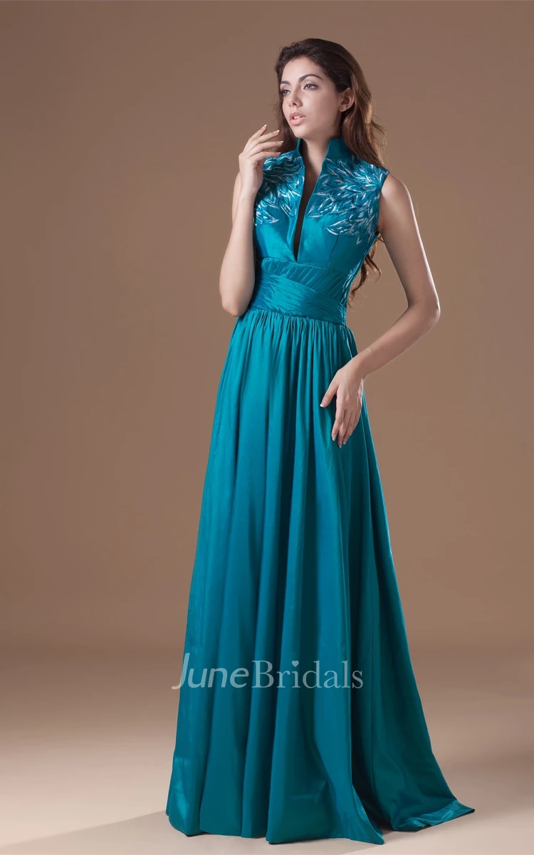 high-neck floor-length sleeveless dress with pleats and embroideries