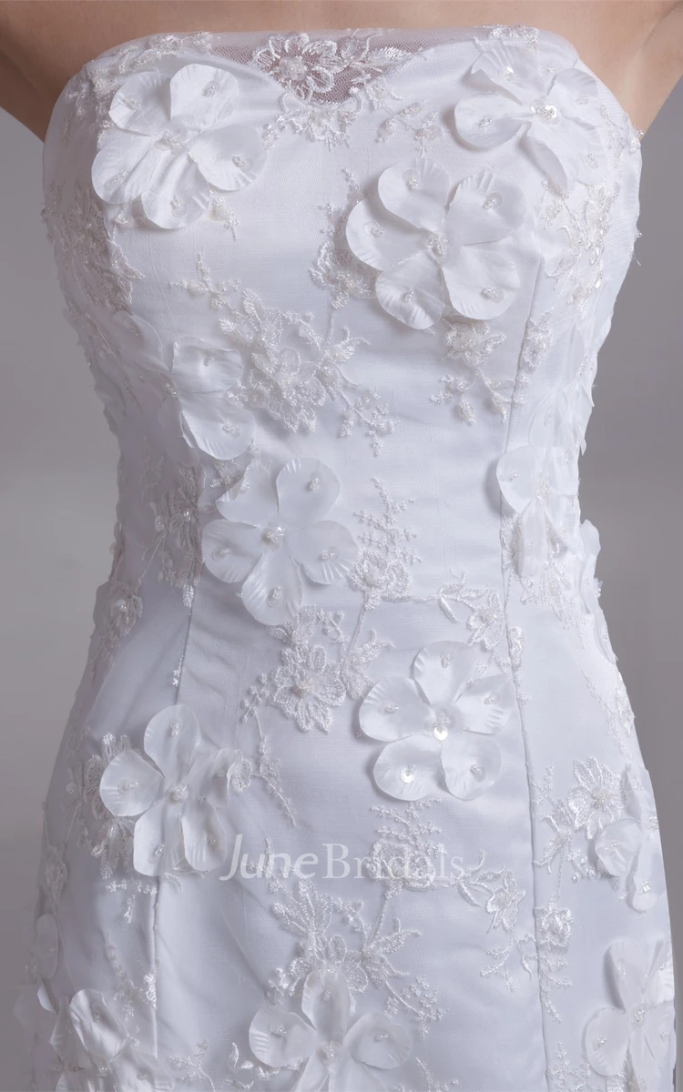 strapless lace mermaid dress with brush train and floral embellishment