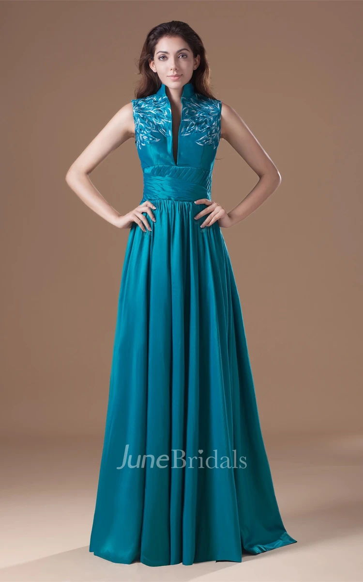 high-neck floor-length sleeveless dress with pleats and embroideries