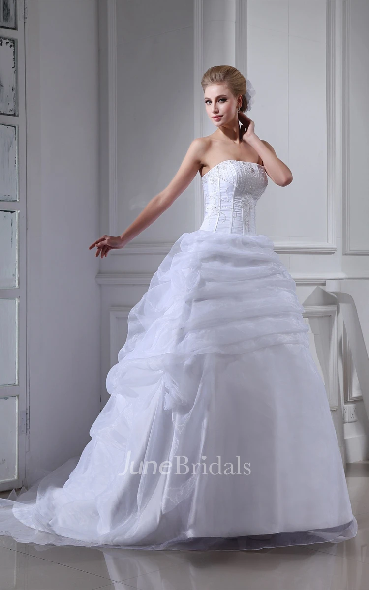 Strapless Ruffled Tulle Ball Gown with Flower and Gemmed Bodice