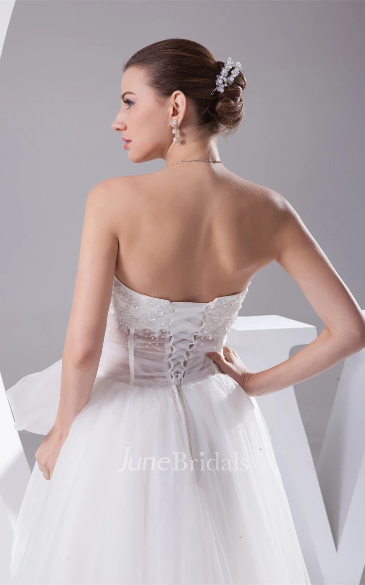 Notched Strapless Tulle A-Line Dress with Bow and Illusion Waist