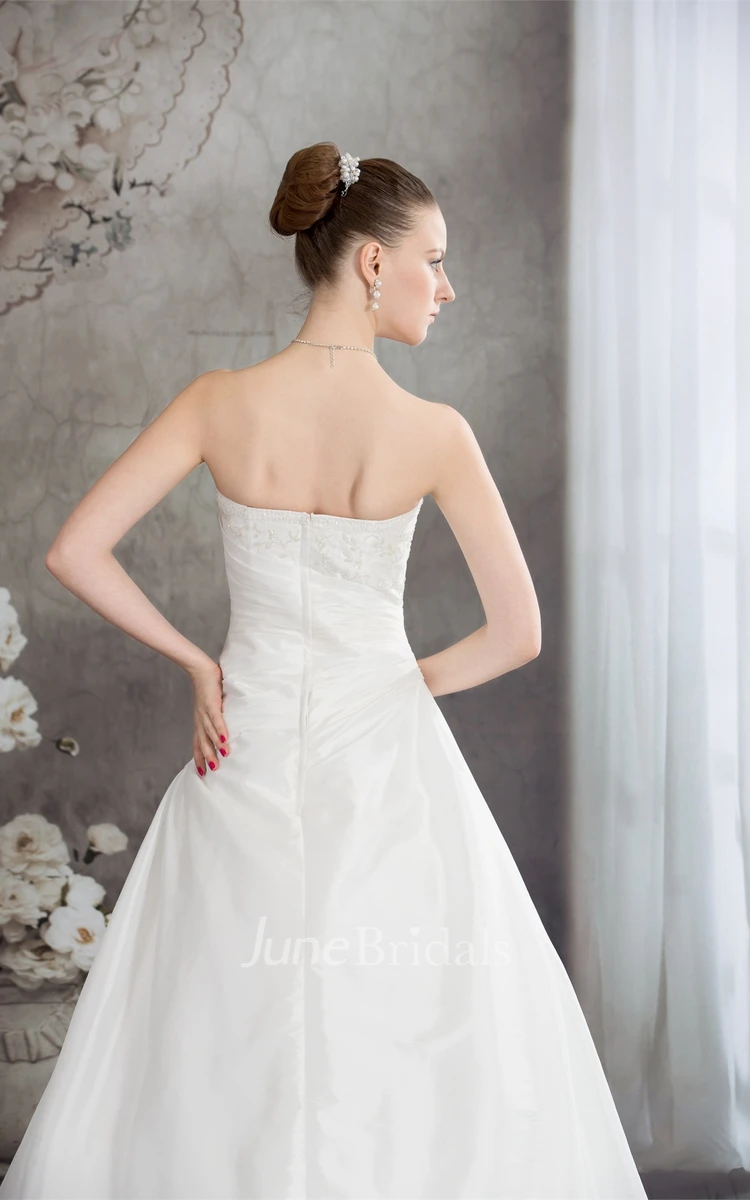 Strapless Appliqued Ball Gown with Beading and Ruching