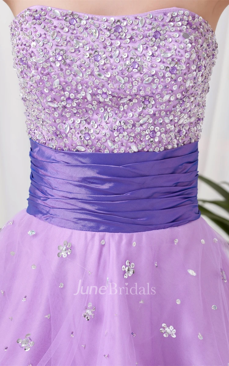 strapless a-line tulle dress with ruched waist and jeweled top
